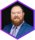 Aaron Lord Hexagon Headshot Purple (1)